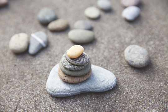 a collection of beautiful weathered stones found on a beach