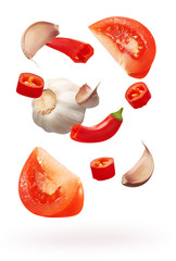 Cut red chili pepper vegetables, garlic and slices of tomato