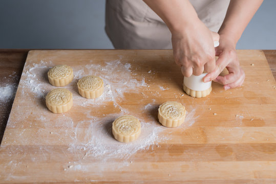 A young Chinese woman is making Moon cake for Mid-Autumn festival