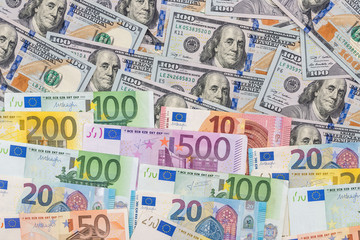 mix dollar and euro bills. background. money.