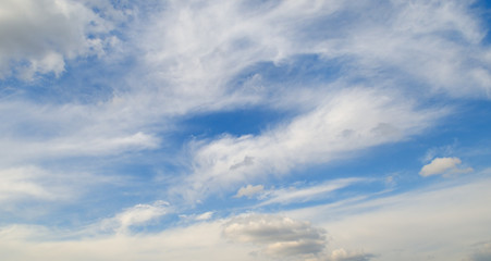 cumulus clouds in the blue sky