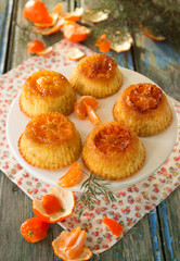 Muffins with caramelized mandarins. Rustic style, selective focus.