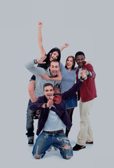 Fototapeta premium Happy group of people with arms up - isolated over white