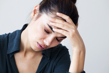 Fototapeta premium Portrait of unhappy woman on gray background