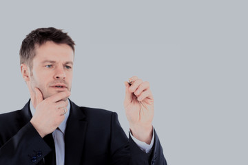Business man writing with a pen, white background