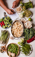 Pasta rigatoni casserole Nourishment cooking ingredients list write person hand vegan food 