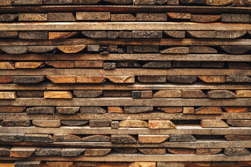 Wooden brown background is from lying horizontally boards. beams wooden boards lying on each other on the market for sale