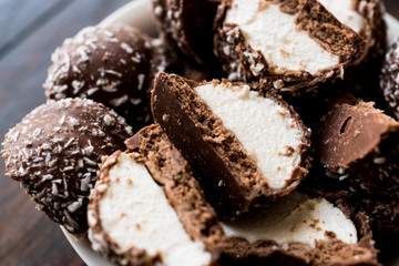 Chocolate Covered Marshmallows with Coconut Powder.
