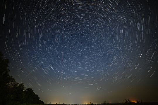 Night sky with bright stars trails. Astrophotography of outer space.