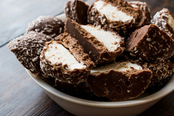 Chocolate Covered Marshmallows with Coconut Powder.
