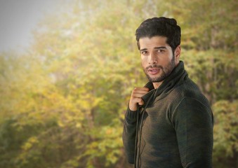 Man in Autumn posing in forest