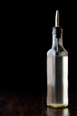 White Vinegar in bottle with rosemary 