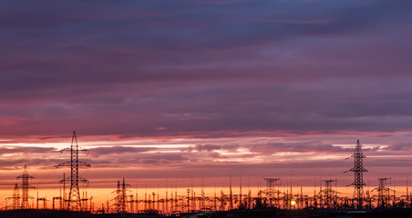 Naklejka premium silhouette substation with sunset background,substation on sunset time.