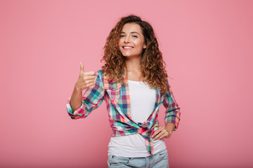 Pretty lady showing thumb up gesture isolated
