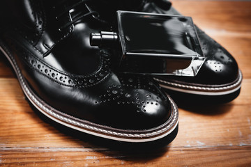 Fototapeta na wymiar classic men's accessories. Shoes with perfume