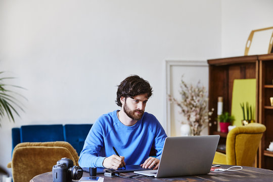Man Using Graphic Tablet At Home