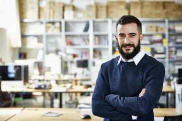 Businessman Standing Arms Crossed In Office