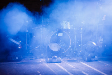 cymbals set in blue light of searchlights