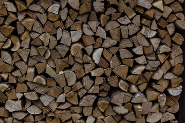 Stacked Logs Texture, Natural Background. Cross section of the timber, firewood stack for the background