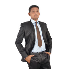 Portrait of a businessman in black suit over white background