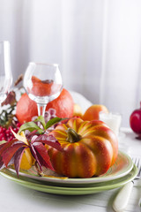Autumn table setting with pumpkins.