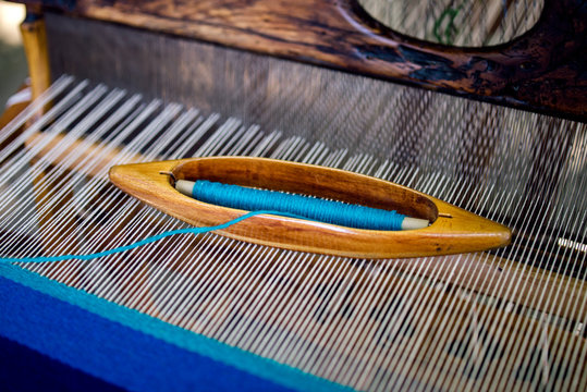 Weaving shuttle on loom