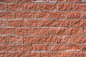 Close-up view of a new, red brick wall background