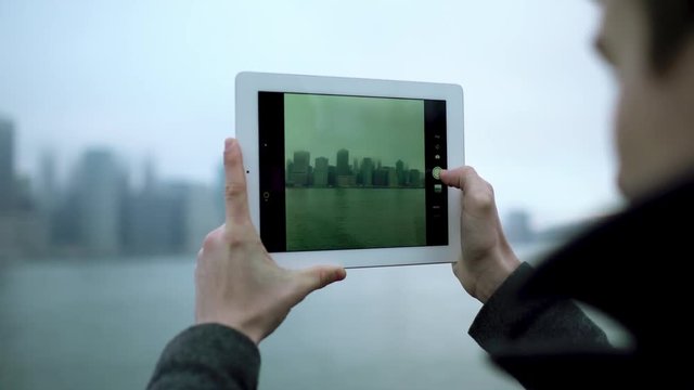 Taking a photo of Manhattan island on tablet pc camera