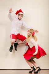 Obraz premium Happy active couple dancing and jumping.