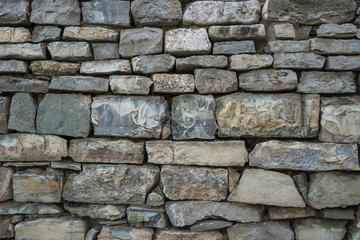 Closeup of old stone wall use for construction business and designers