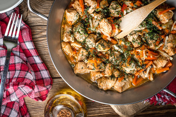 Fried chicken pieces with vegetables.
