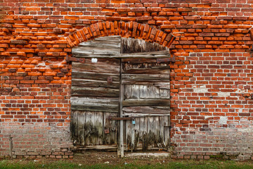 Fototapeta na wymiar Old bricks wall texture with doors.