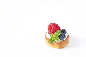 Belgian One Waffle with blueberry, raspberries and fresh mint Isolated