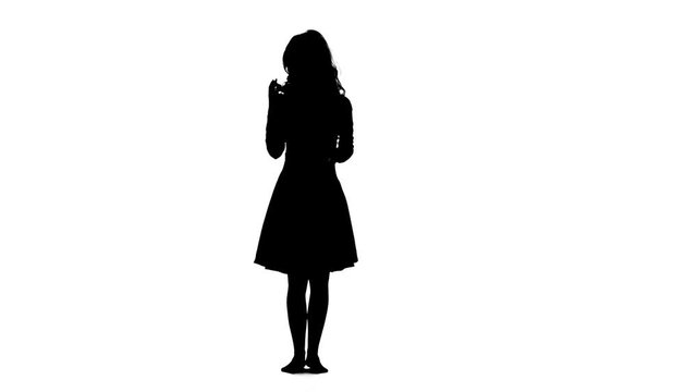 Girl dancing. White background. Silhouette