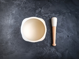 mortar for spices on stone background, top view