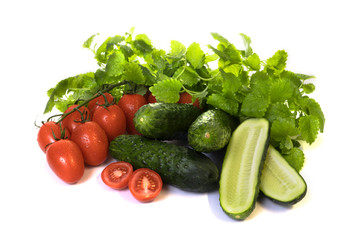 vegetables cucumbers and tomatoes on a white background