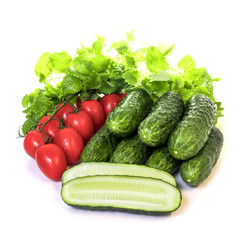 vegetables cucumbers and tomatoes on a white background