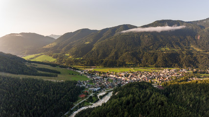 Fototapeta premium Valley opening towards a small city.