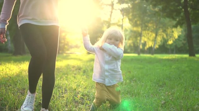 Funny child. Child play with mother.