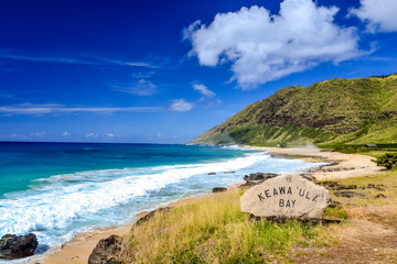 Beautiful Keawa'Ula Bay and Keawaula Beach on the Hawaiian island of Oahu near the westernmost point of Oahu, Ka'ena Point. Sunny day, dangerous waves and a 
