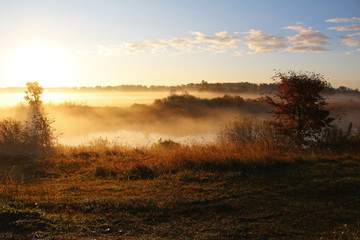 Misty nature landscape on early autumn morning. Russia.