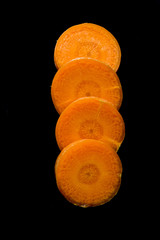 Carrot Slices on Black Background