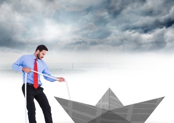 Obraz premium Businessman pulling paper boat with rope in sky