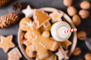 Milk and cookies. Gingerbread  cookies on a gray background.  Christmas cookies.  Ginger men