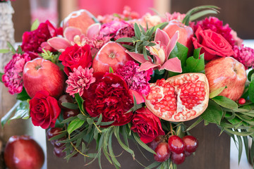 red flowers with decoration and apples, white background
