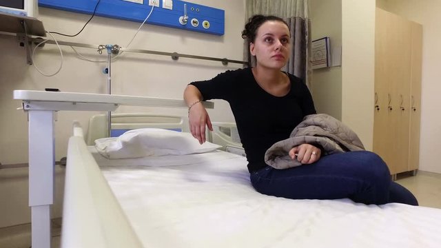 Beautiful Girl Waiting In Hospital Bed For Discharge After Clinical 