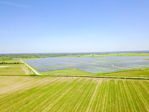 Aerial View Of Solar Farm Near Austin, Texas, USA. Renewable Energy Background.