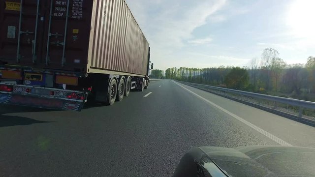 Truck, lorry overtaking on rural road, pov, point of view