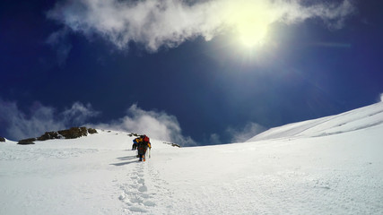 Naklejka na ściany i meble Alpinists pov climbing at Alps mountain, Mont Blanc during sunny day