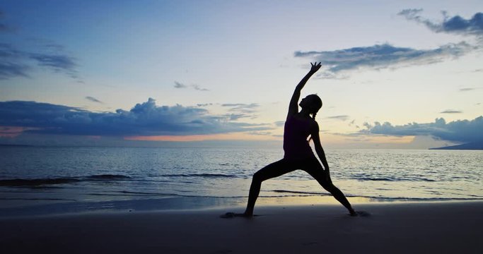 Woman Practicing Yoga at Sunset